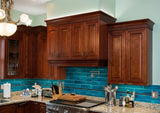 Kitchen with wooden cabinets, blue tiled backsplash, and stainless steel appliances.